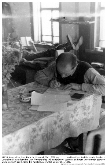 Oberleutnant Karl-Hermann Lion (Vordergrund) und unbekannter Leutnant an einem unbekannten Standort und Unterkunft der III./St.G. 1 in Russland, vermutlich Winter 1941/1942. NLESB_Kriegsbilder_lose_Filmrolle_Russland_1941_0036 Oberleutnant Karl-Hermann Lion (Vordergrund) und unbekannter Leutnant an einem unbekannten Standort und Unterkunft der III./St.G. 1 in Russland, vermutlich Winter 1941/1942. NLESB_Kriegsbilder_lose_Filmrolle_Russland_1941_0036