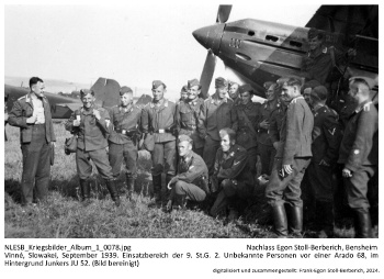 Vinné, Slowakei, September 1939. Einsatzbereich der 9. St.G. 2. Unbekannte Personen vor einer Arado 68, im Hintergrund Junkers JU 52. (Bild bereinigt). NLESB_Kriegsbilder_Album1_0078.